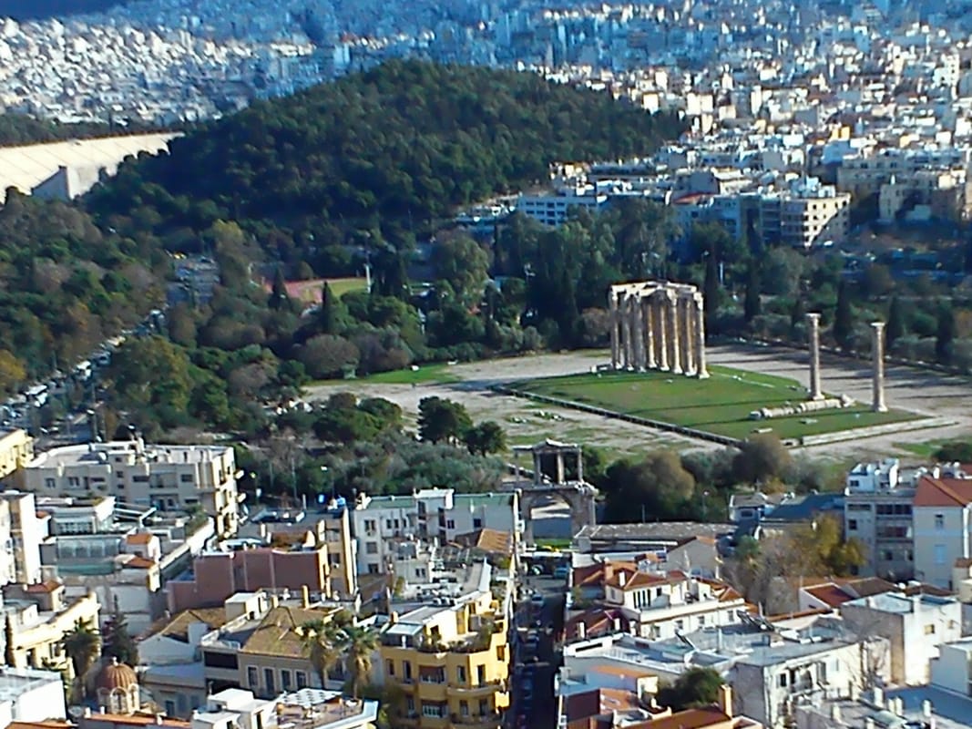 The Temple of Olympian Zeus as seen from the Acropolis. At the forefront, Hadrian's Arch, and at the far back left the Panathenaic Olympic Stadium. Photo courtesy Sophia Yiannakou.